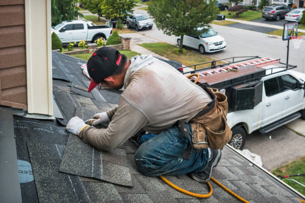 Professional Storm Damage Roof Repair technician working in Akron, MI